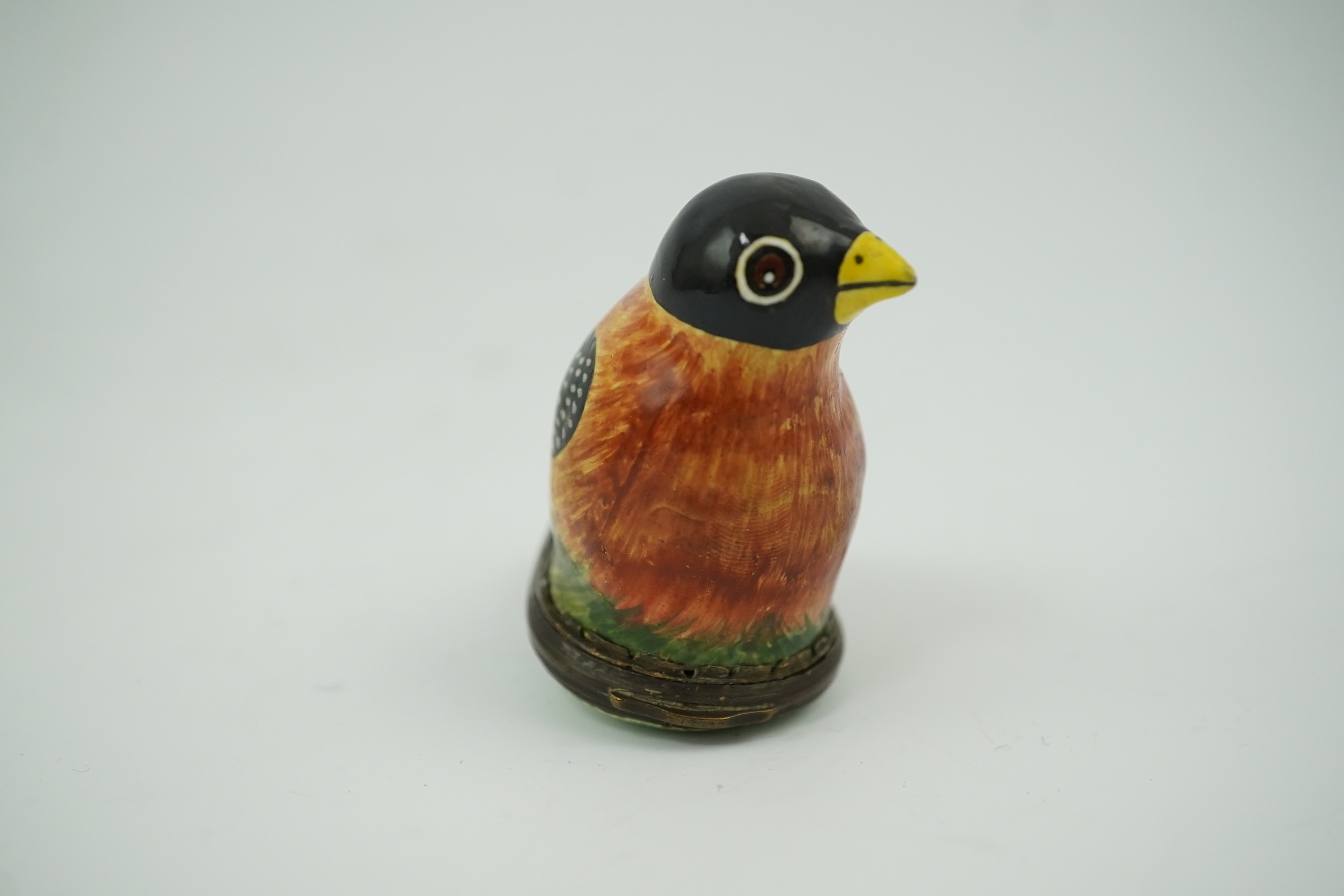 An 18th century South Staffordshire (Bilston) enamel box modelled as a bird with floral decorated cover, 4.5cm high. Condition - fair